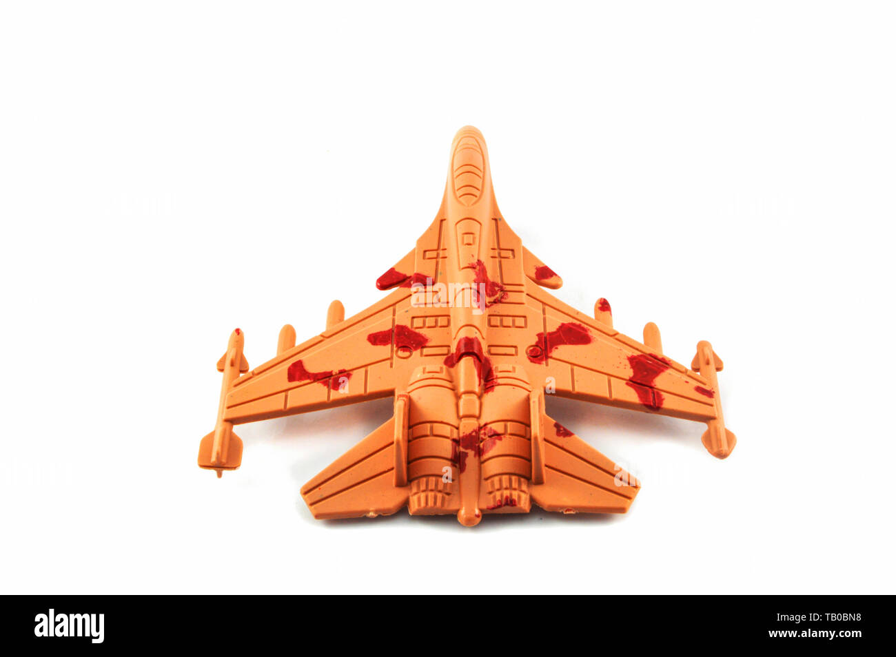 Les avions à réaction fighter toy isolé sur fond blanc / orange camouflage militaire toy airplane Banque D'Images