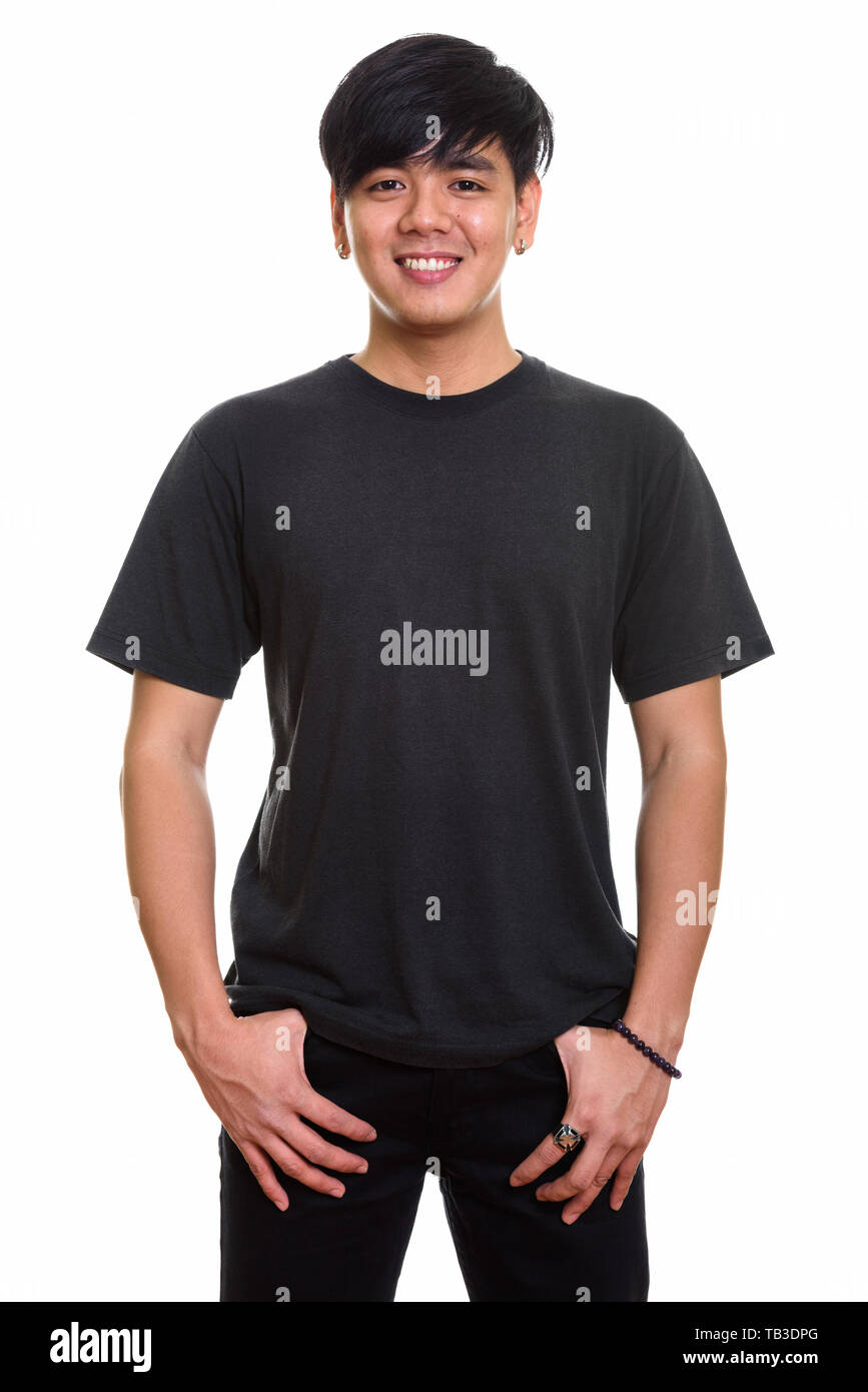 Studio shot of cool happy Asian man smiling Banque D'Images