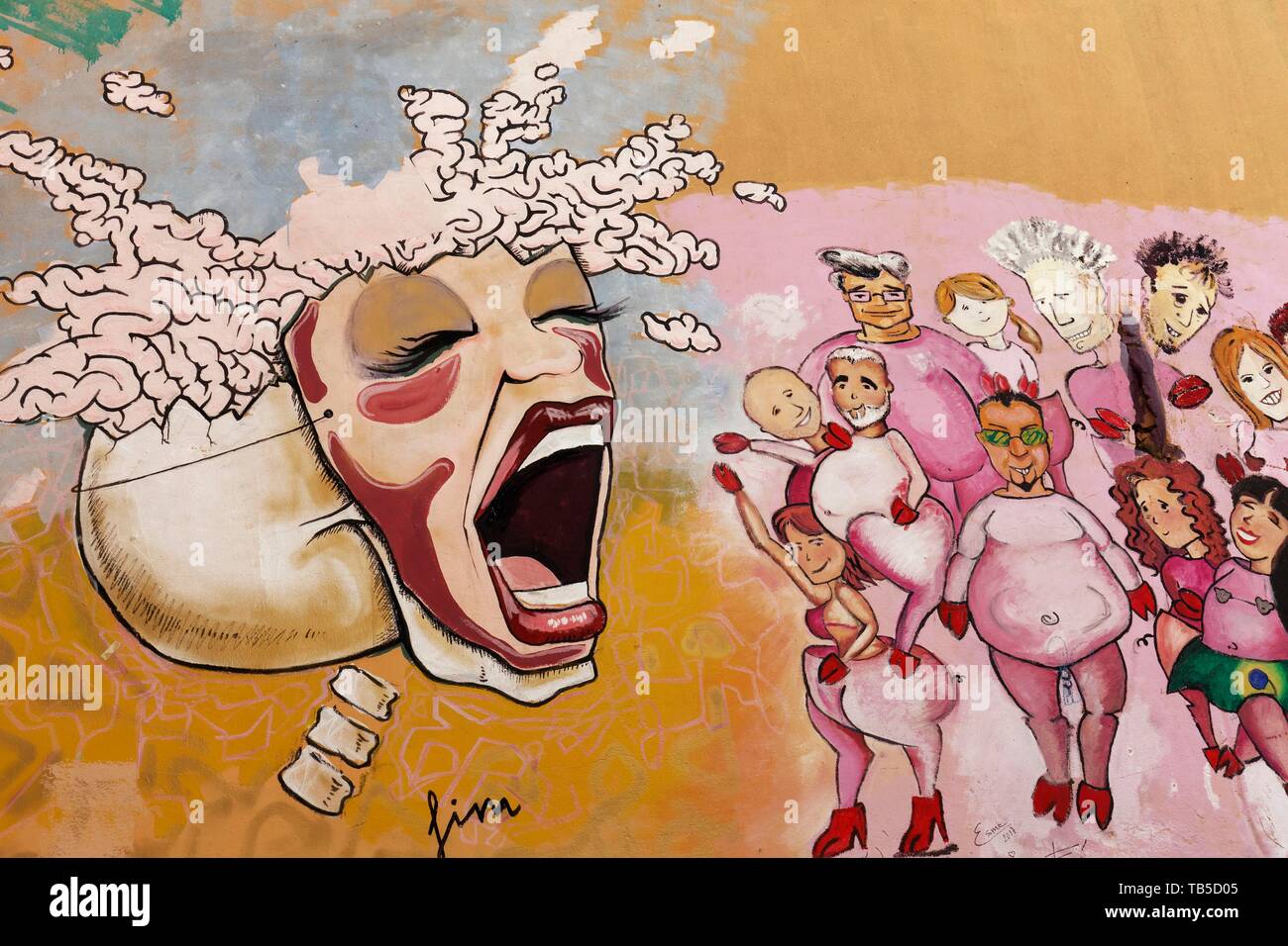 Crâne avec masque lié sur femme crie à un groupe de personnes, graffito, art de rue dans le district de Carme, vieille ville, Valencia, Espagne Banque D'Images