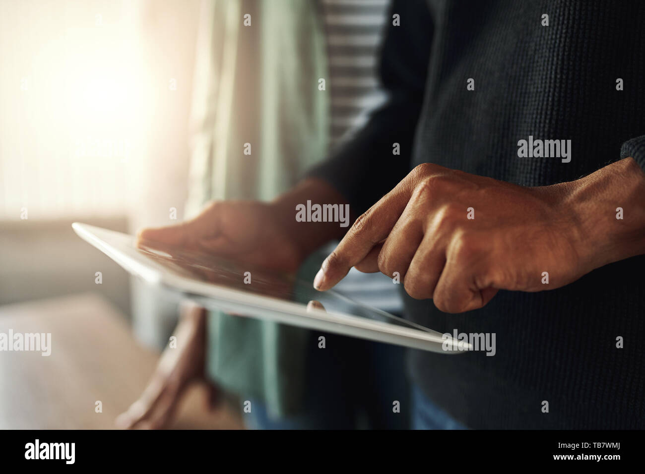 Close-up of a man on digital tablet Banque D'Images
