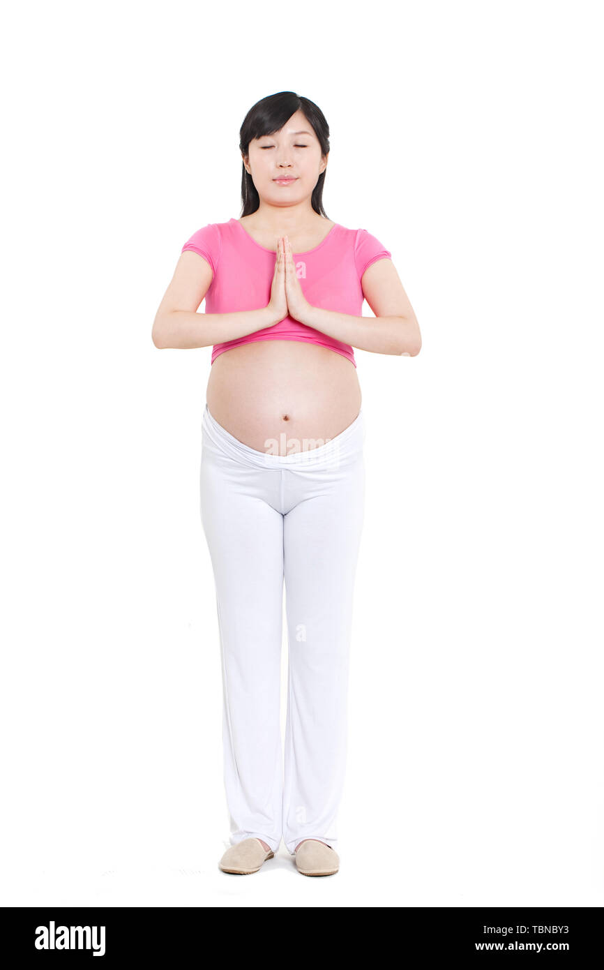 Une femme enceinte fonctionne. Banque D'Images