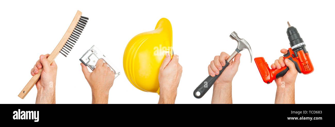 Outils à main. Mains tenant les outils de construction isolé sur fond blanc. Banque D'Images Outils à main. Mains tenant les outils de construction isolé sur fond blanc. Banque D'Images
