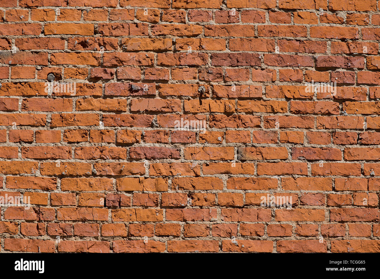 La texture du mur de brique rouge antique. Banque D'Images