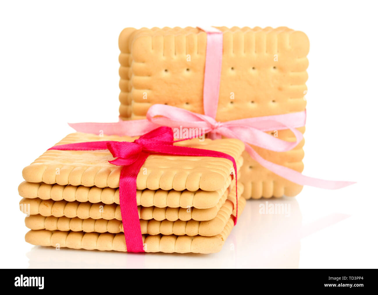 Sweet cookies attachées avec un ruban rose isolated on white Banque D'Images