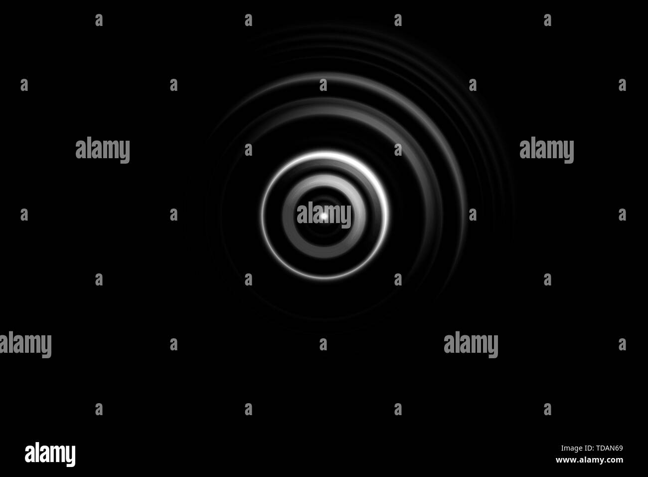 Résumé cible blanche cercle avec anneau lumineux sur fond noir Banque D'Images