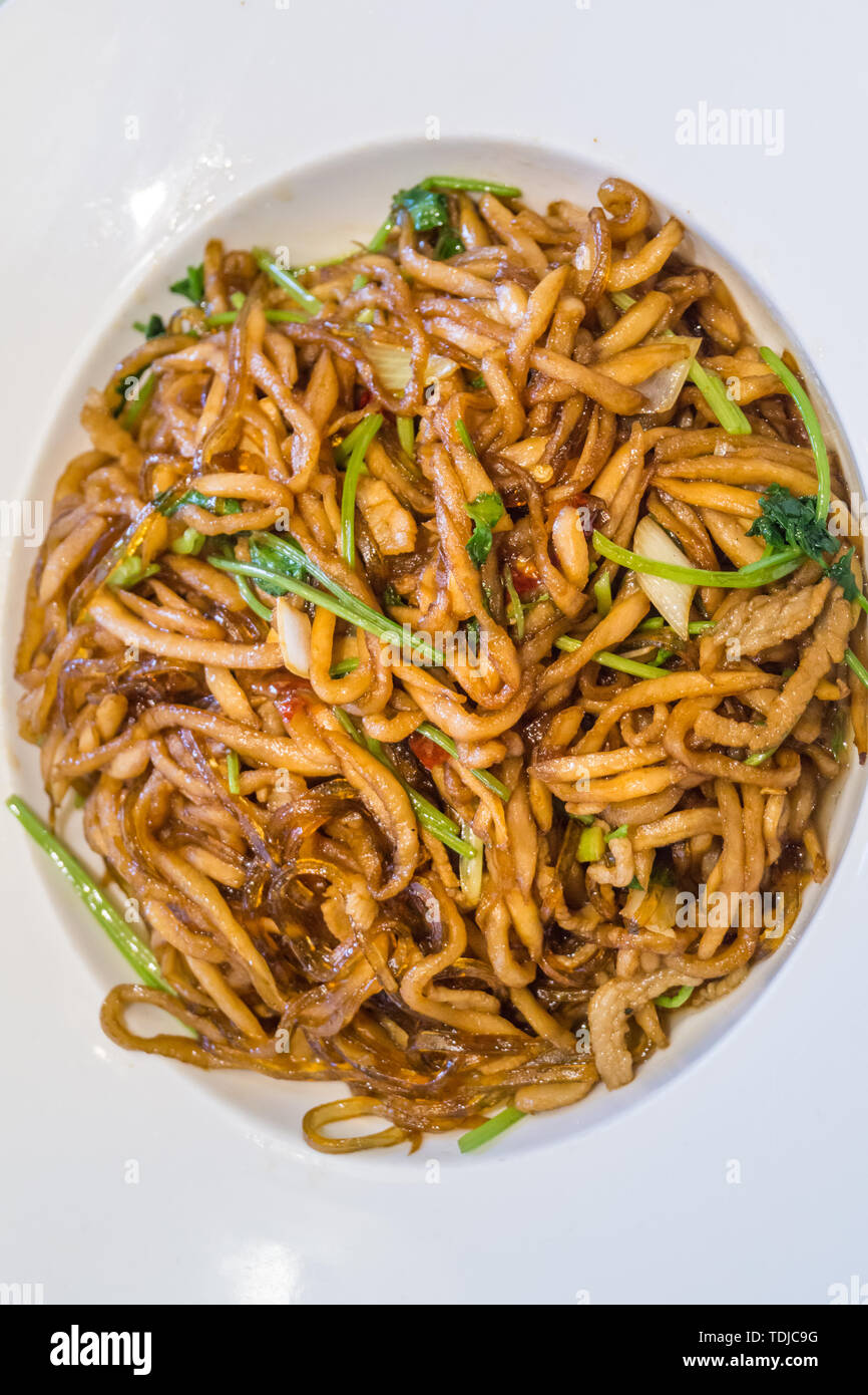 Une assiette de plat chinois bandes radis sauté de close-up du ventilateur Banque D'Images