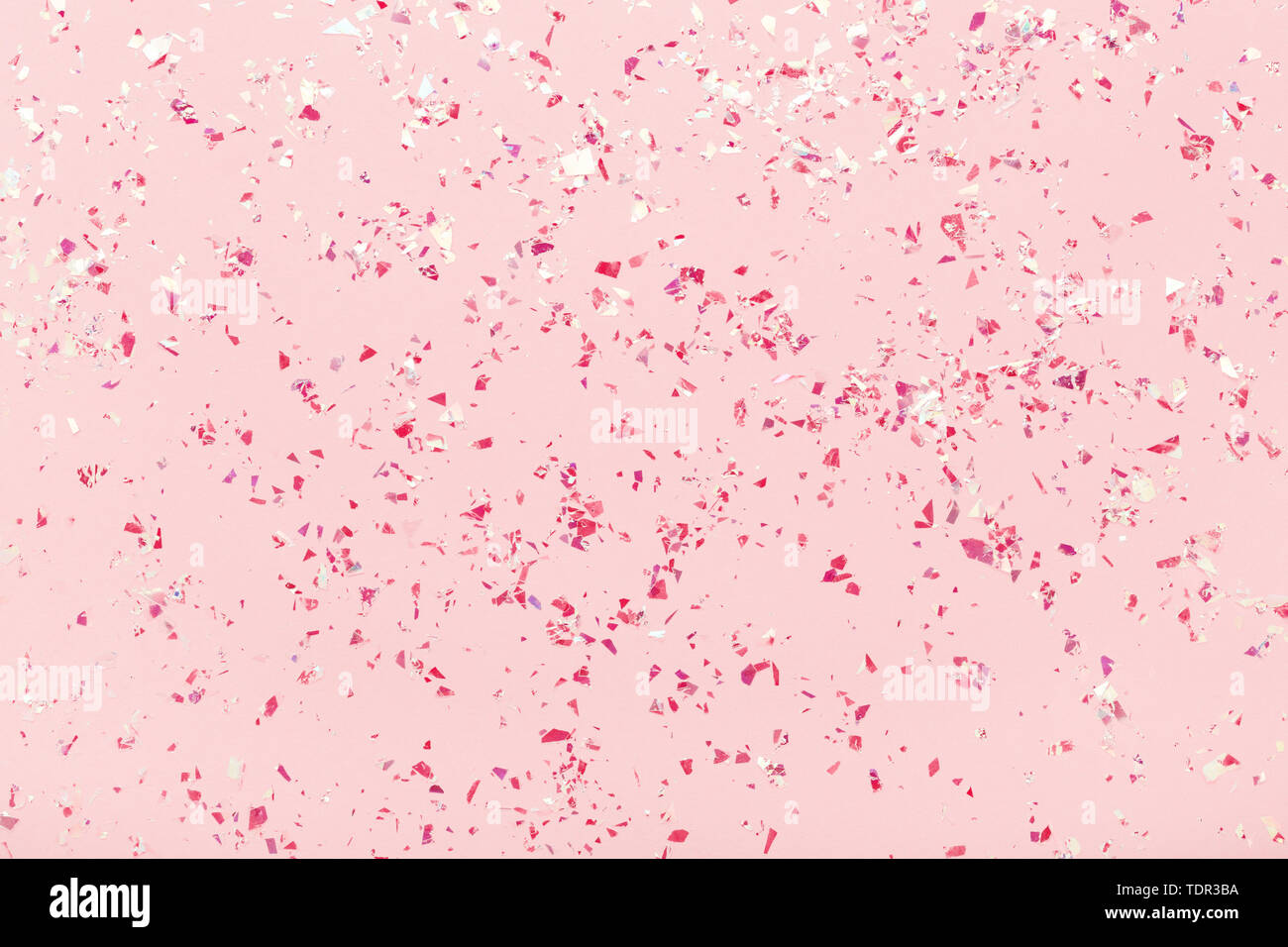 Mica Glitter sparkles rouge sur fond rose tendance pastel. Abstrait toile  de fête. Mise à plat Photo Stock - Alamy