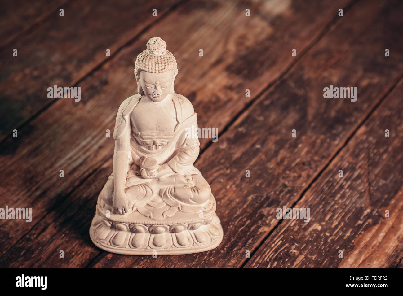 Figurine blanche du bouddha du fossile Banque D'Images