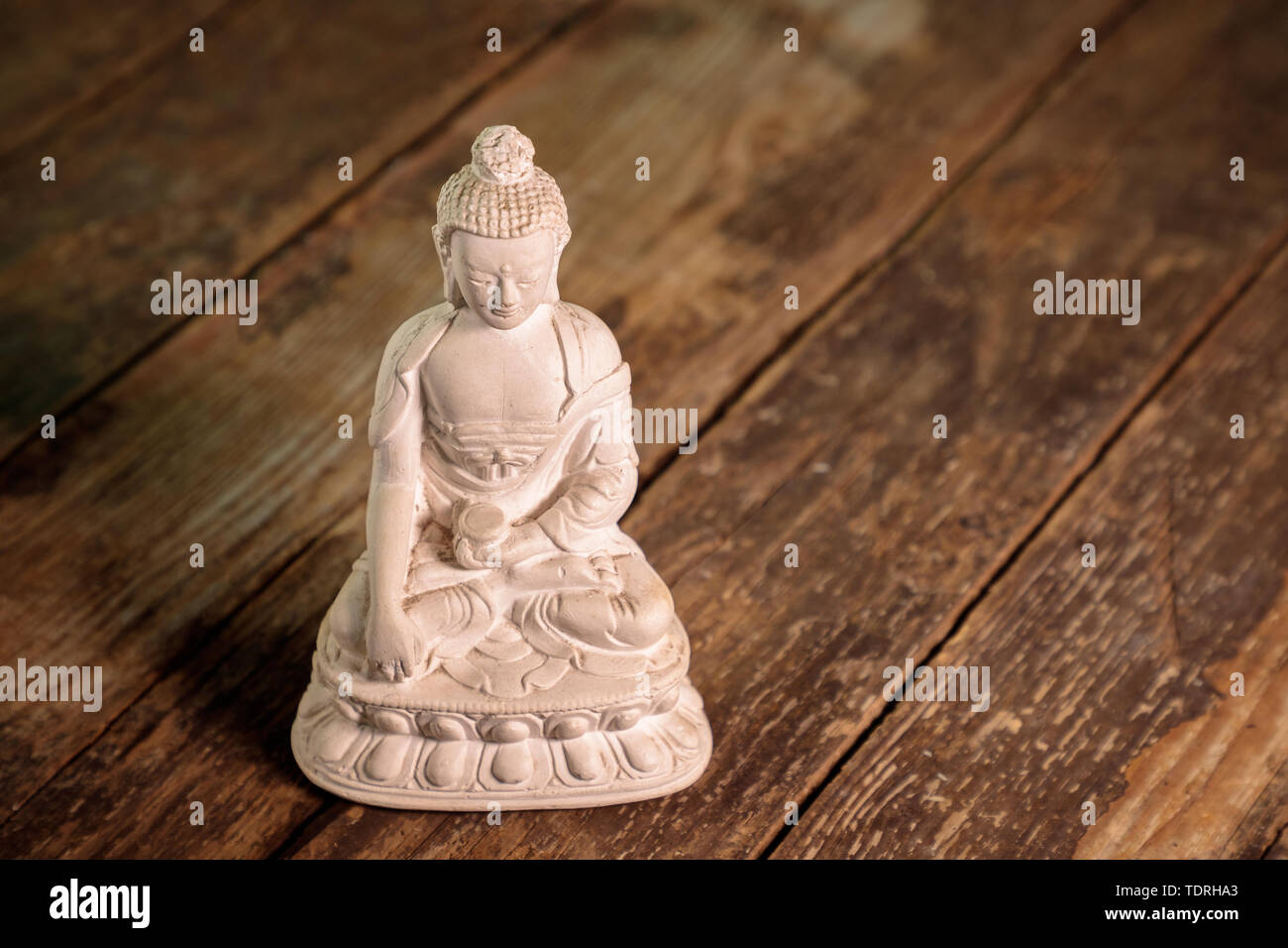 Figurine blanche du bouddha du fossile Banque D'Images