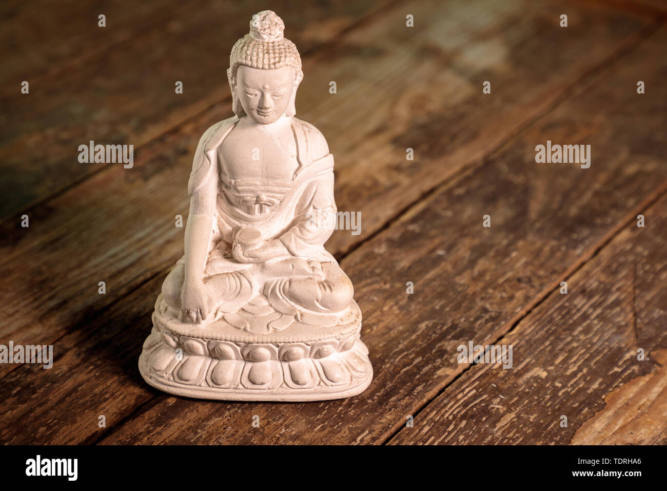 Figurine blanche du bouddha du fossile Banque D'Images