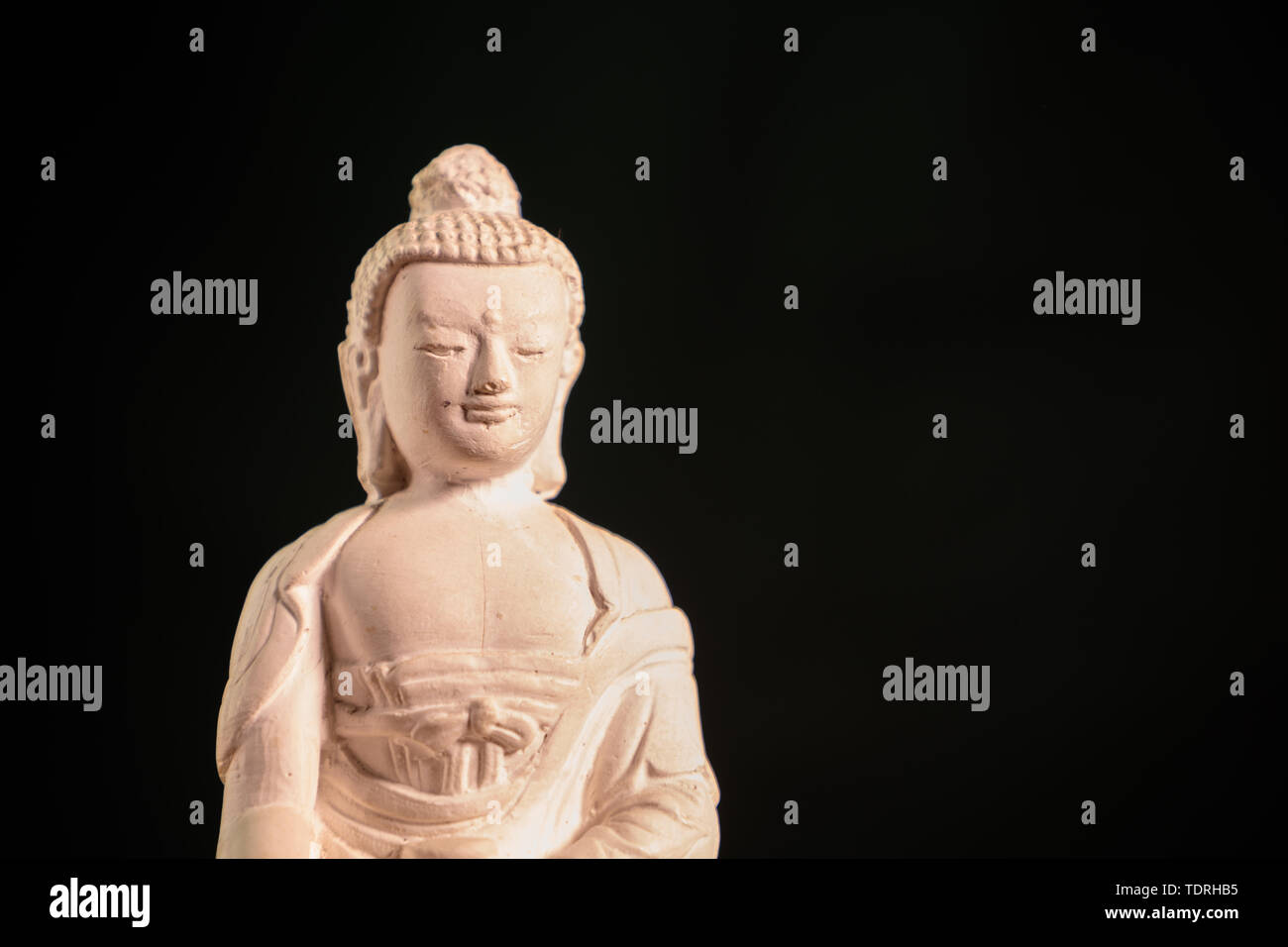 Figurine blanche du bouddha du fossile Banque D'Images