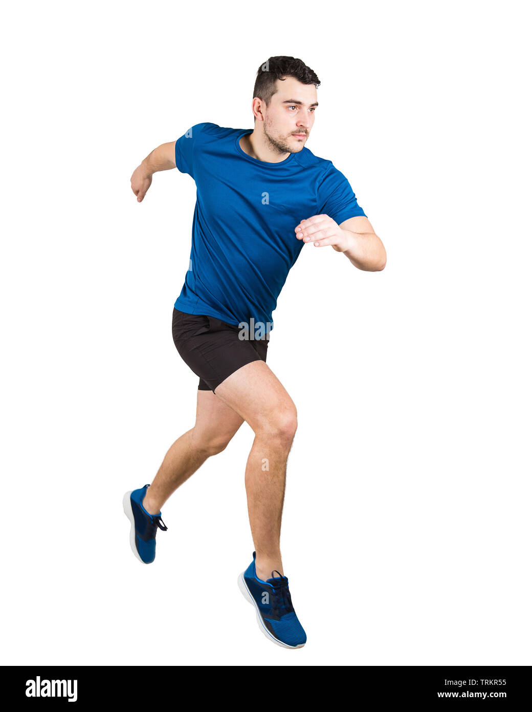 De toute la longueur déterminée caucasian man running vitesse rapide athlète isolated over white background. Jeune mec runner vêtu de noir et bleu sportswear Banque D'Images