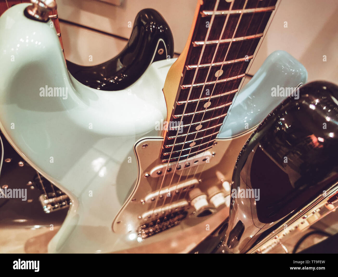 Vintage blue guitar fret board close up Banque D'Images