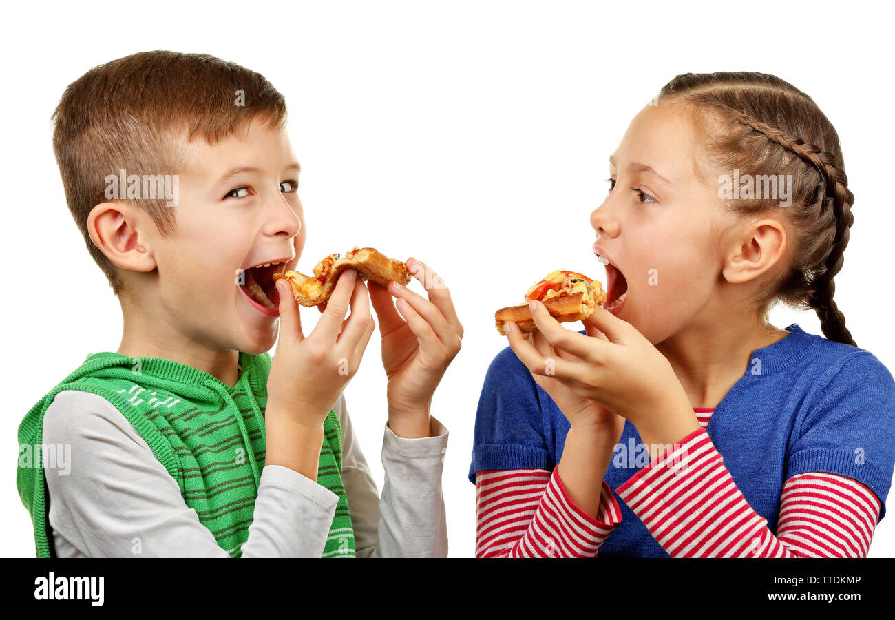 Les enfants de manger des pizzas isolated on white Banque D'Images