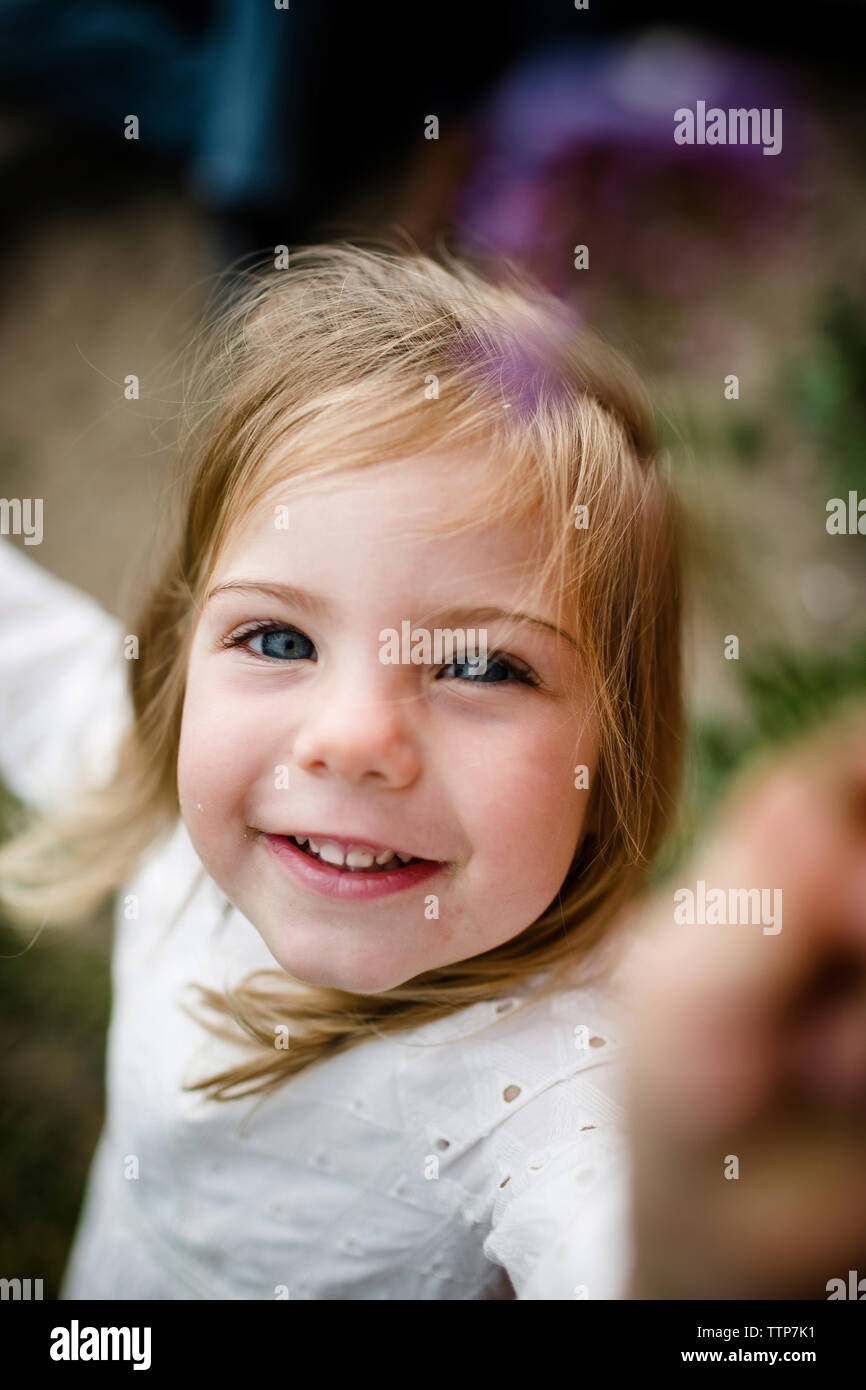 High angle portrait of happy baby girl standing at tourist resort Banque D'Images