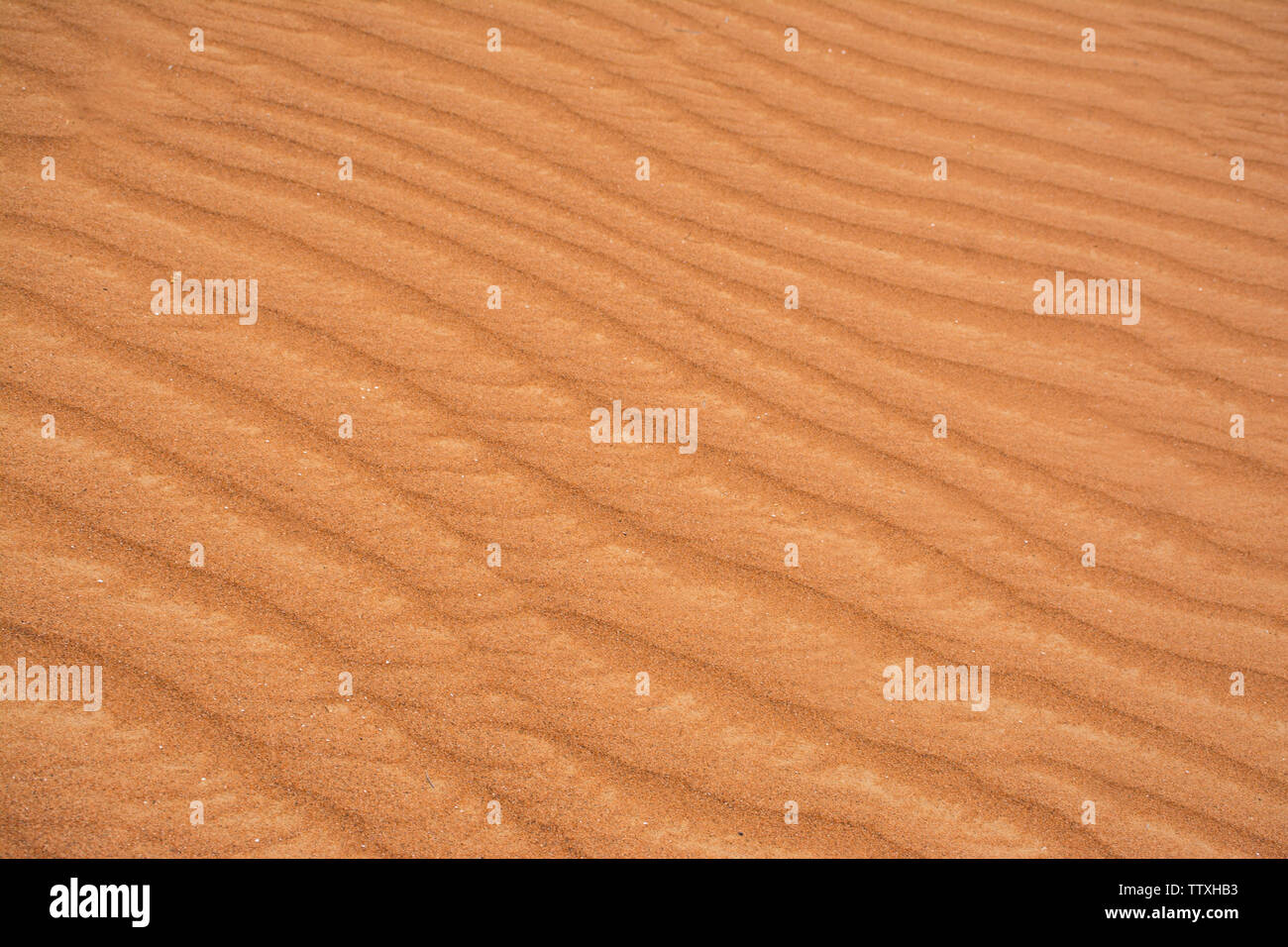 Belle Texture sable coloré fond ombre orange modèle desert sand dune prise rapprochée des vagues de sable du désert Banque D'Images
