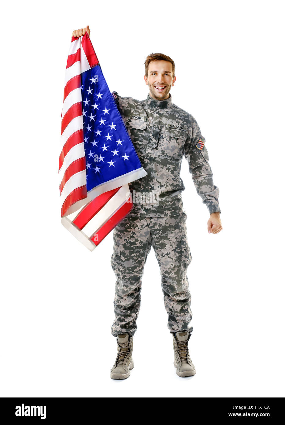 Soldier holding American flag Banque D'Images