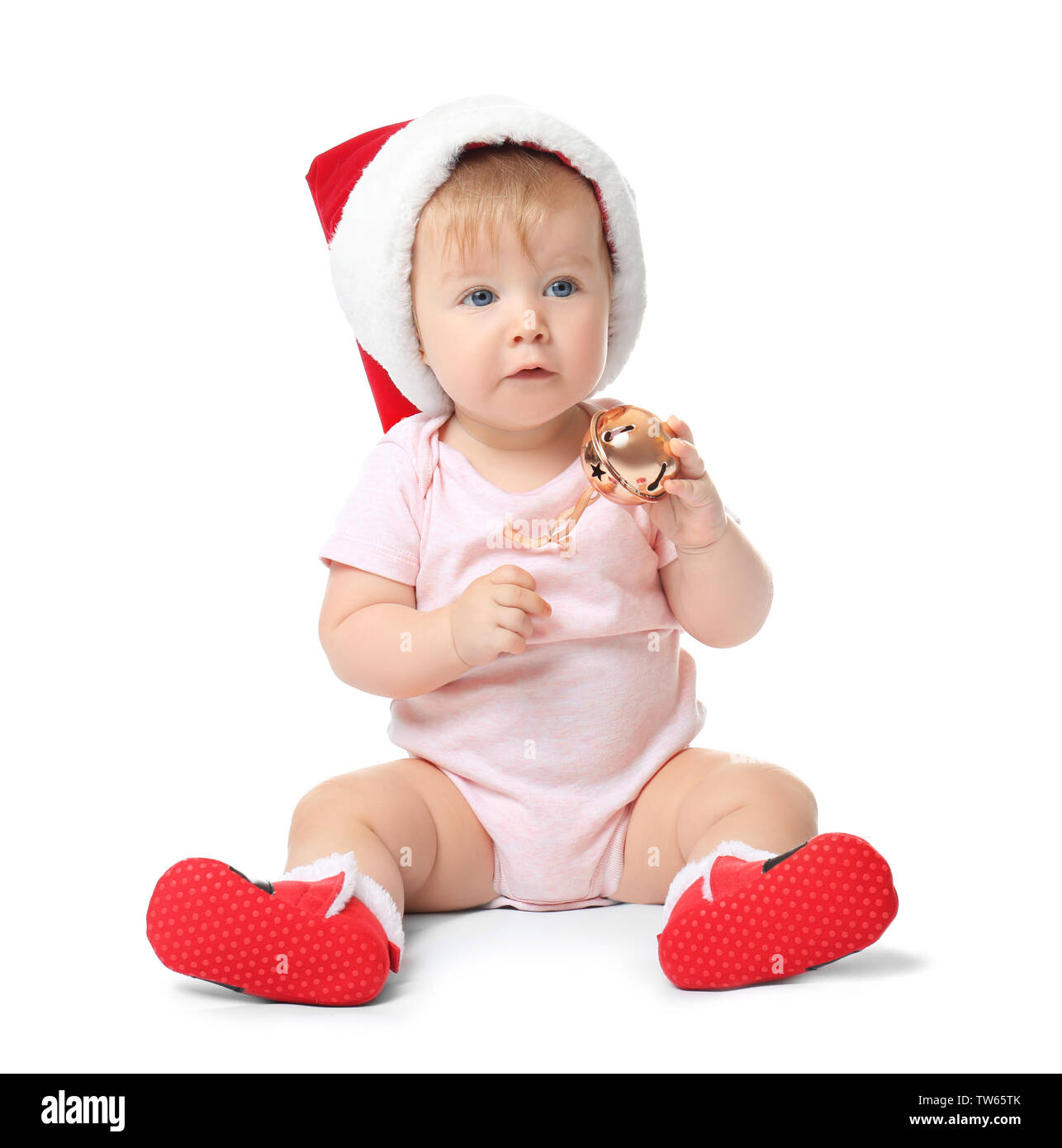 Adorable baby in Santa Claus hat sur fond blanc Banque D'Images