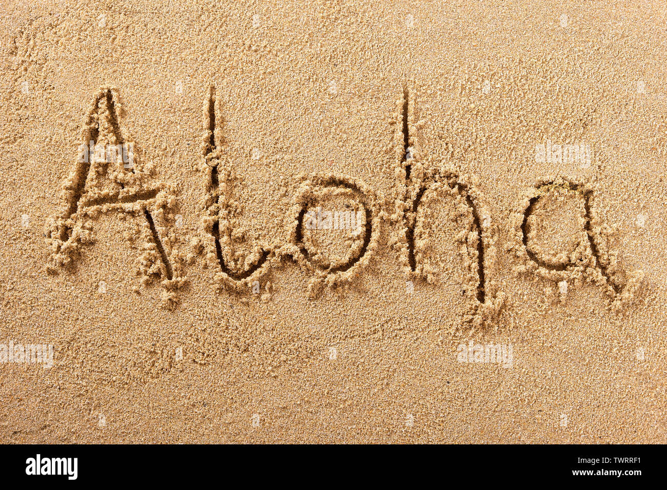 Aloha hawaii beach accueil mot écrit dans le sable Banque D'Images