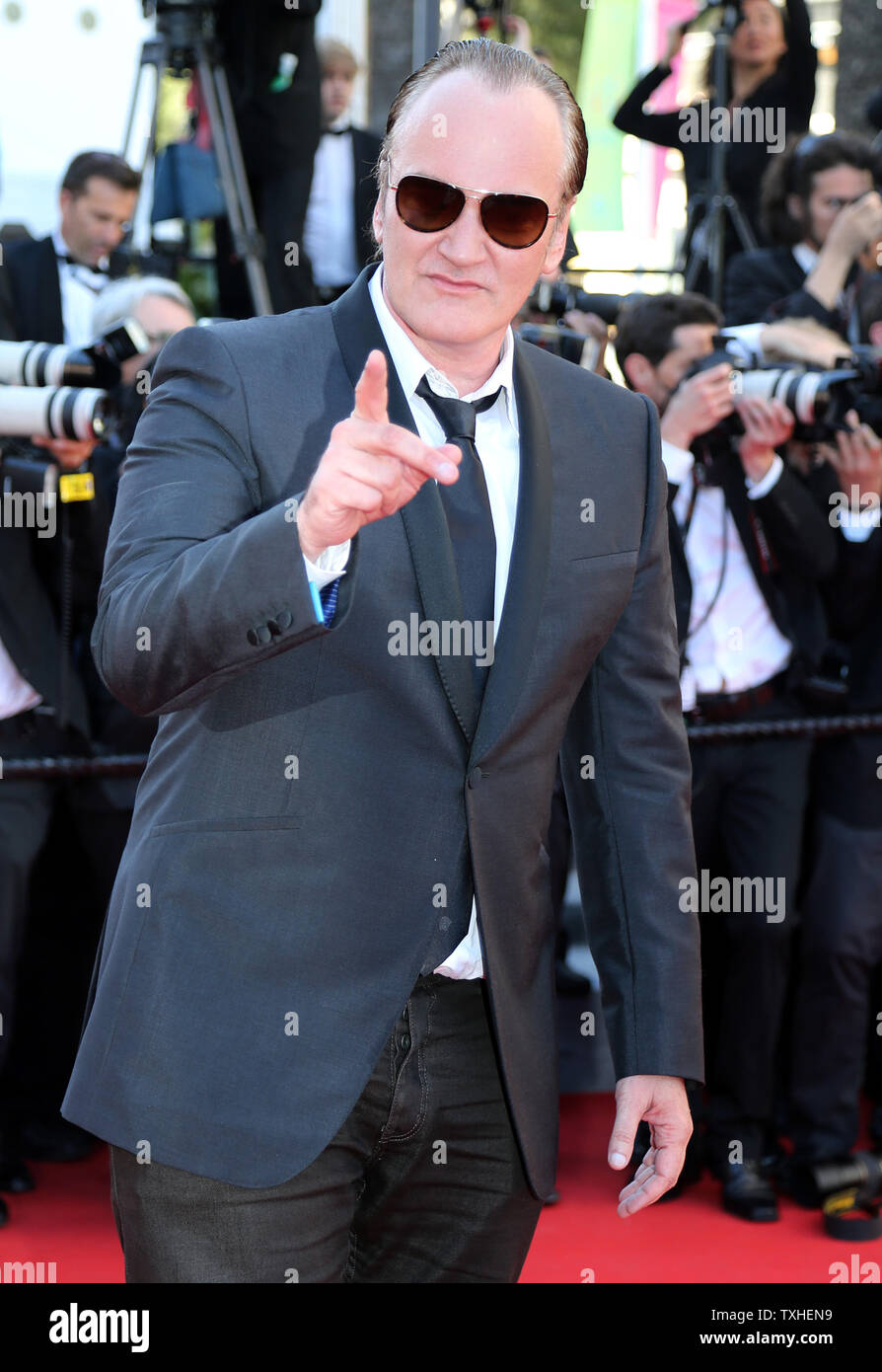 Quentin Tarantino arrive sur le tapis rouge de la cérémonie de clôture avant la projection du film "Poignée de Dollars" lors de la 67 e assemblée annuelle du Festival International du Film de Cannes à Cannes, France le 24 mai 2014. UPI/David Silpa Banque D'Images