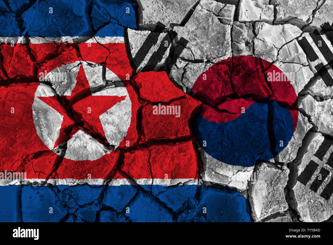 Concept de crise et conflit de Corée du Sud et la Corée du Nord . Les drapeaux sur fond sol fissuré . Banque D'Images