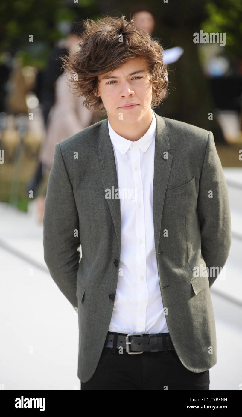 Chanteur et membre du groupe One Direction Harry assiste à la style Burberry Prorsum Printemps/Été 2013 Défilé de mode lors de la London Fashion Week qui a eu lieu dans les jardins de Kensington à Londres le 17 septembre 2012. UPI/Paul Treadway.. Banque D'Images
