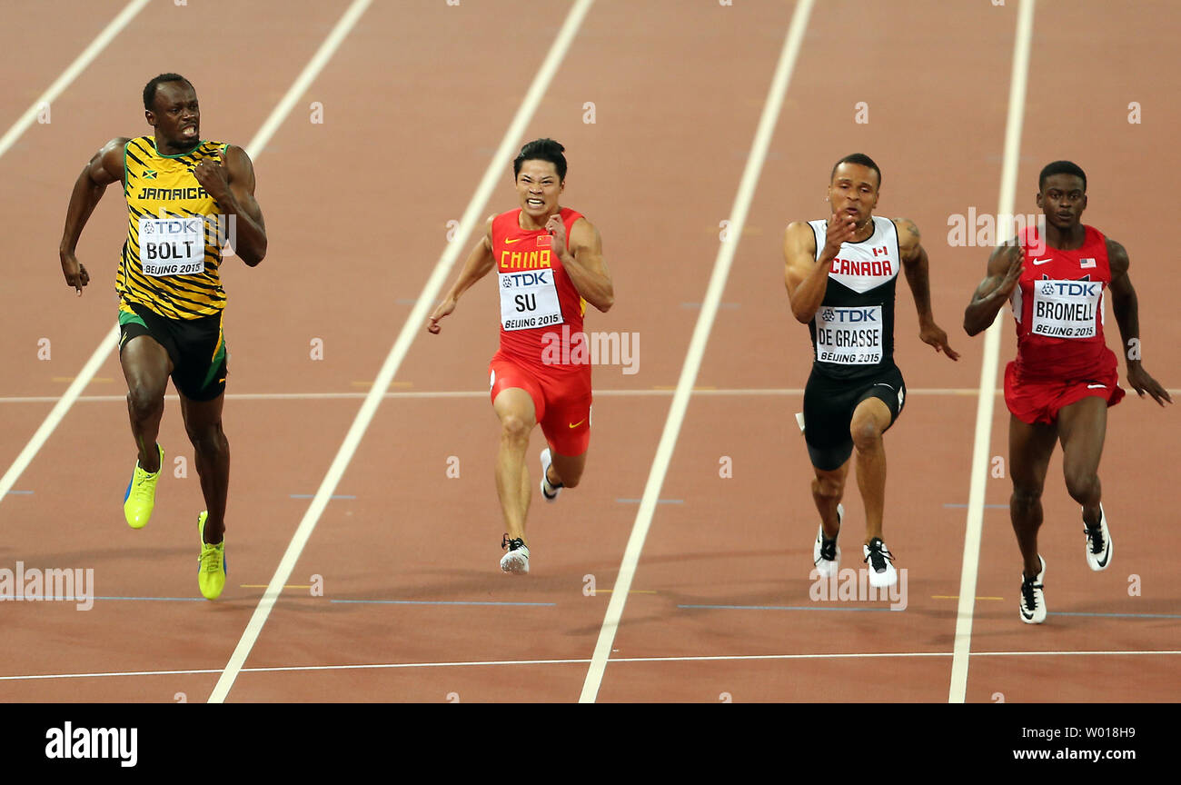 Usain Bolt de la Jamaïque (L), la Chine a su BingTian (2e-L), Canada's André DeGrasse (2nd-R) et l'USA Trayvon Bromell concurrence sur le 100 mètres à la demi-finale aux Championnats du monde de l'IAAF organisée par Pékin le 23, août. Boulon et DeGrasse à égalité au troisième, Su et Bromell terminé à égalité au septième. Photo par Stephen Shaver/UPI Banque D'Images