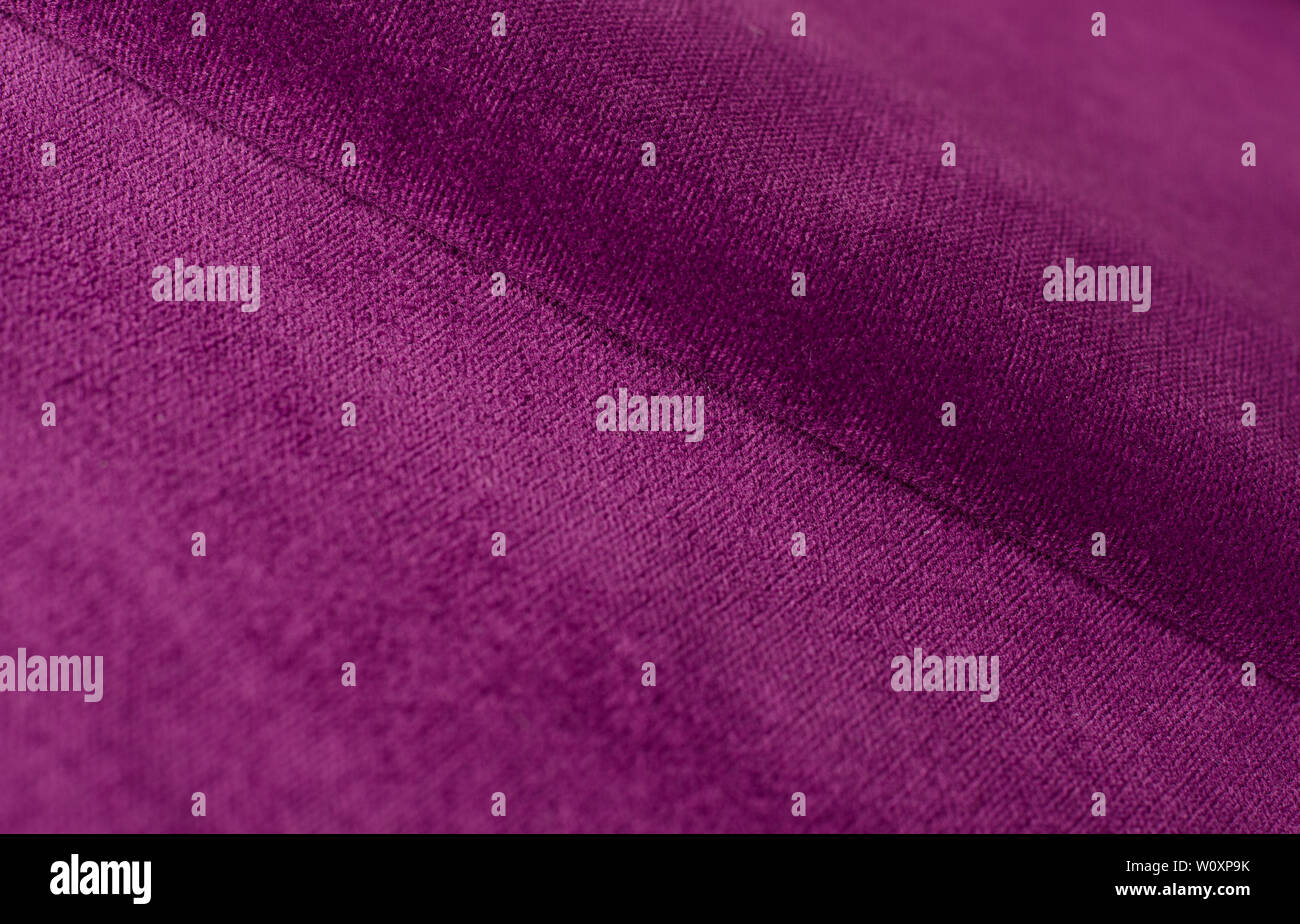 Velours violet lumineux textile. Fond texture tissu Banque D'Images