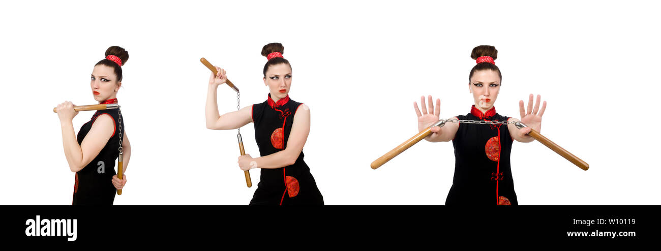 Femme drôle avec nunchucks isolated on white Banque D'Images