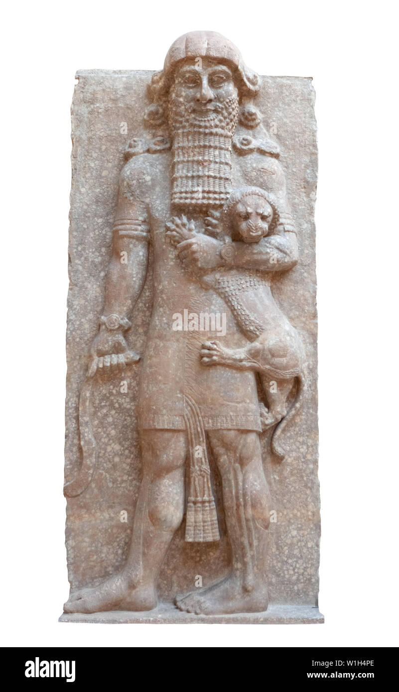 Gilgamesh en tant que maître des animaux, un lion tenant dans son bras gauche et serpent dans sa main droite dans un palais assyrien de Dur-Sharrukin secours Banque D'Images