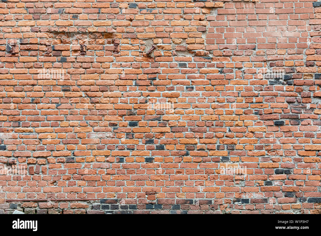 Vieux mur de briques usées endommagées background Banque D'Images