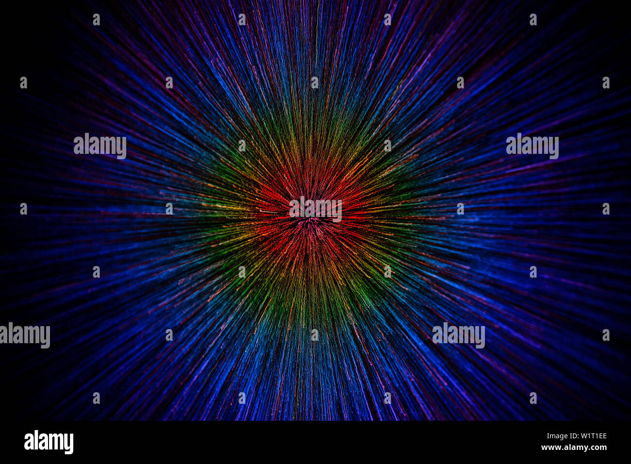Objectif zoom naturel dégradé radial explosion couleurs flou points sur fond noir avec focus sélectif. Banque D'Images