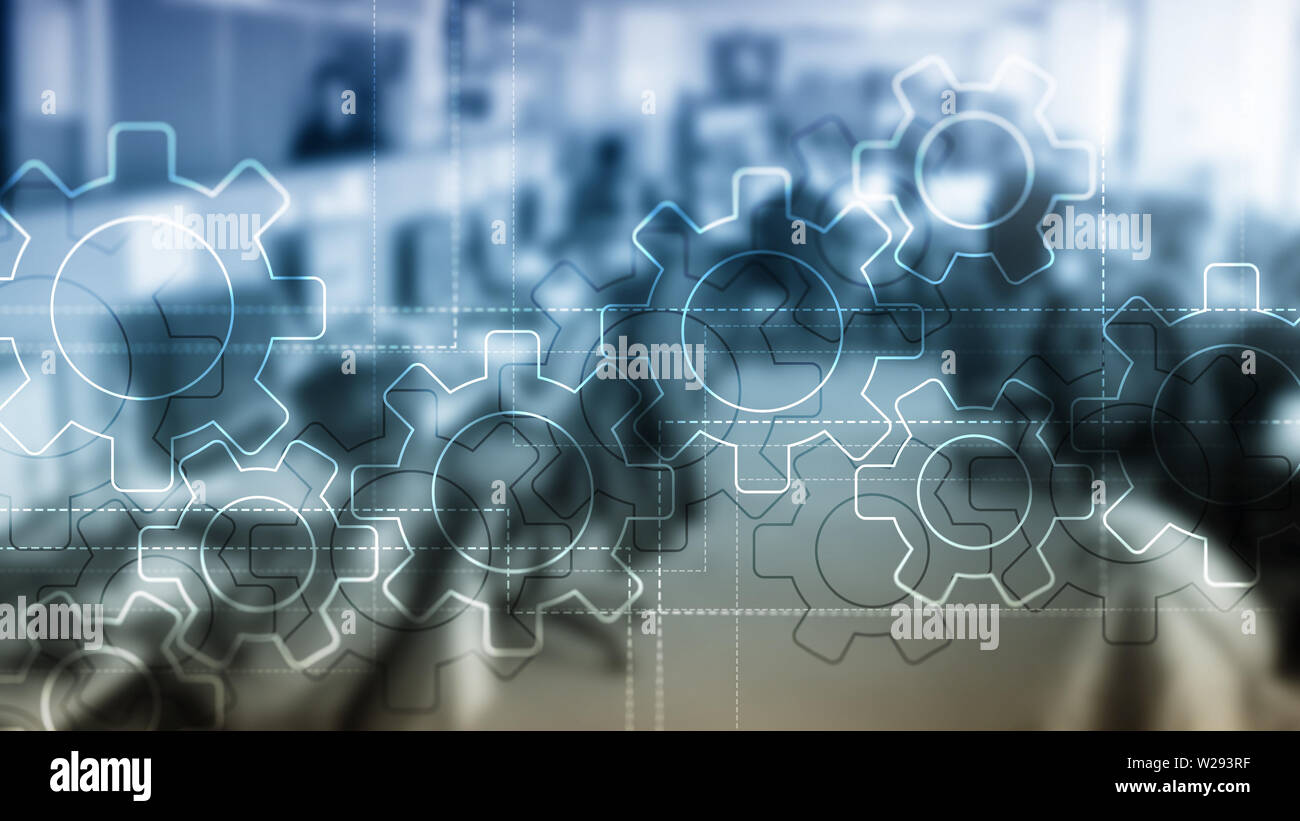 L'exposition Double mécanisme des engrenages sur fond flou. Automatisation des processus industriels et d'entreprise concept. Banque D'Images