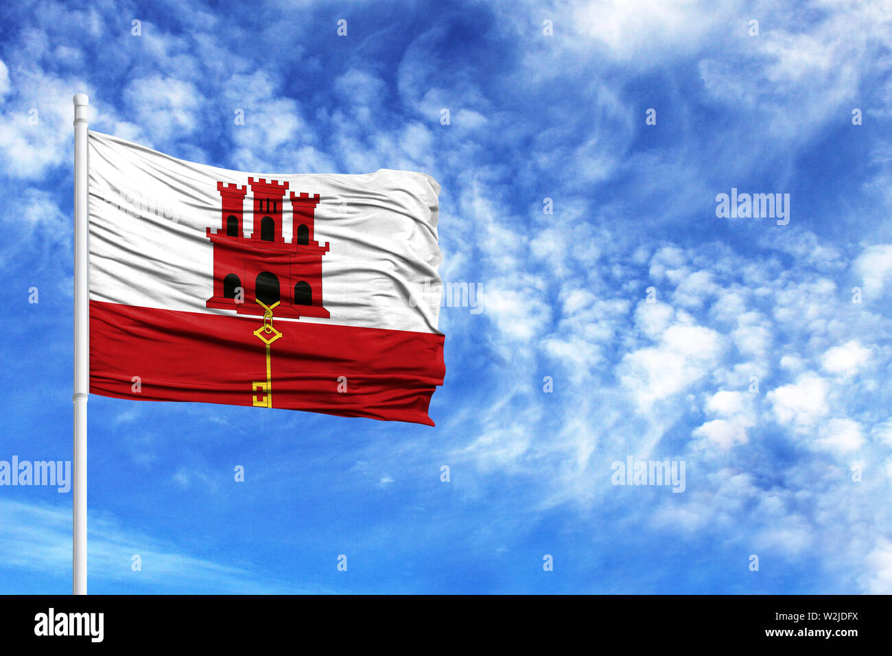 Drapeau national de Gibraltar sur un poteau en face de ciel bleu Banque D'Images