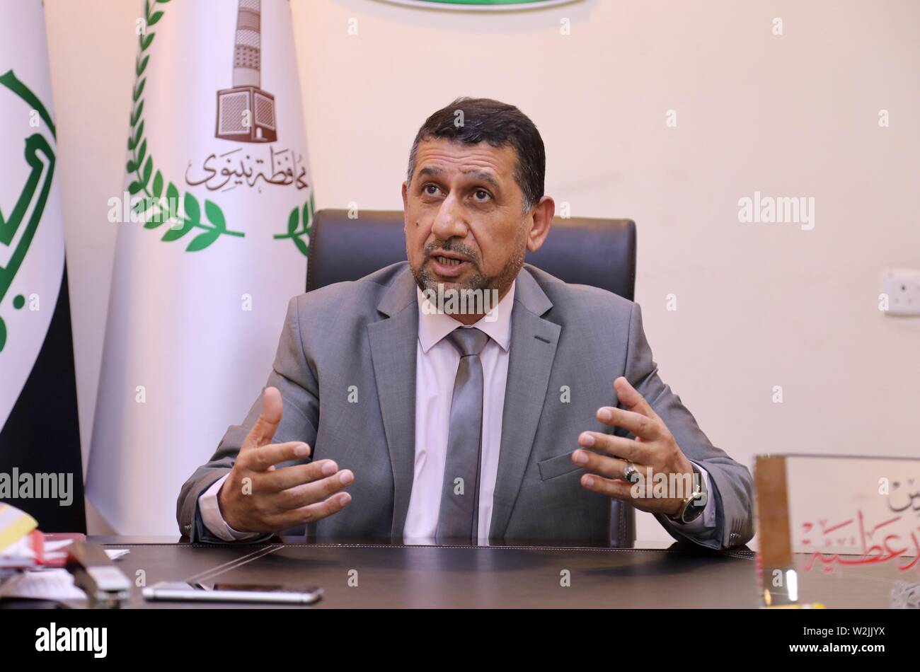 Mossoul, Irak. 2 juillet, 2019. Nouveau gouverneur de Ninive Mansour al-mar'eed parle à Xinhua dans une interview à son bureau dans la province de Ninive, l'Iraq, le 2 juillet 2019. Le gouverneur de province du nord de l'Iraq de Ninive a appelé les entreprises chinoises à participer à la reconstruction de sa capitale Mossoul. Pour ALLER AVEC : gouverneur irakien invite les entreprises chinoises à participer à la reconstruction de Mossoul. Credit : Khalil Dawood/Xinhua/Alamy Live News Banque D'Images
