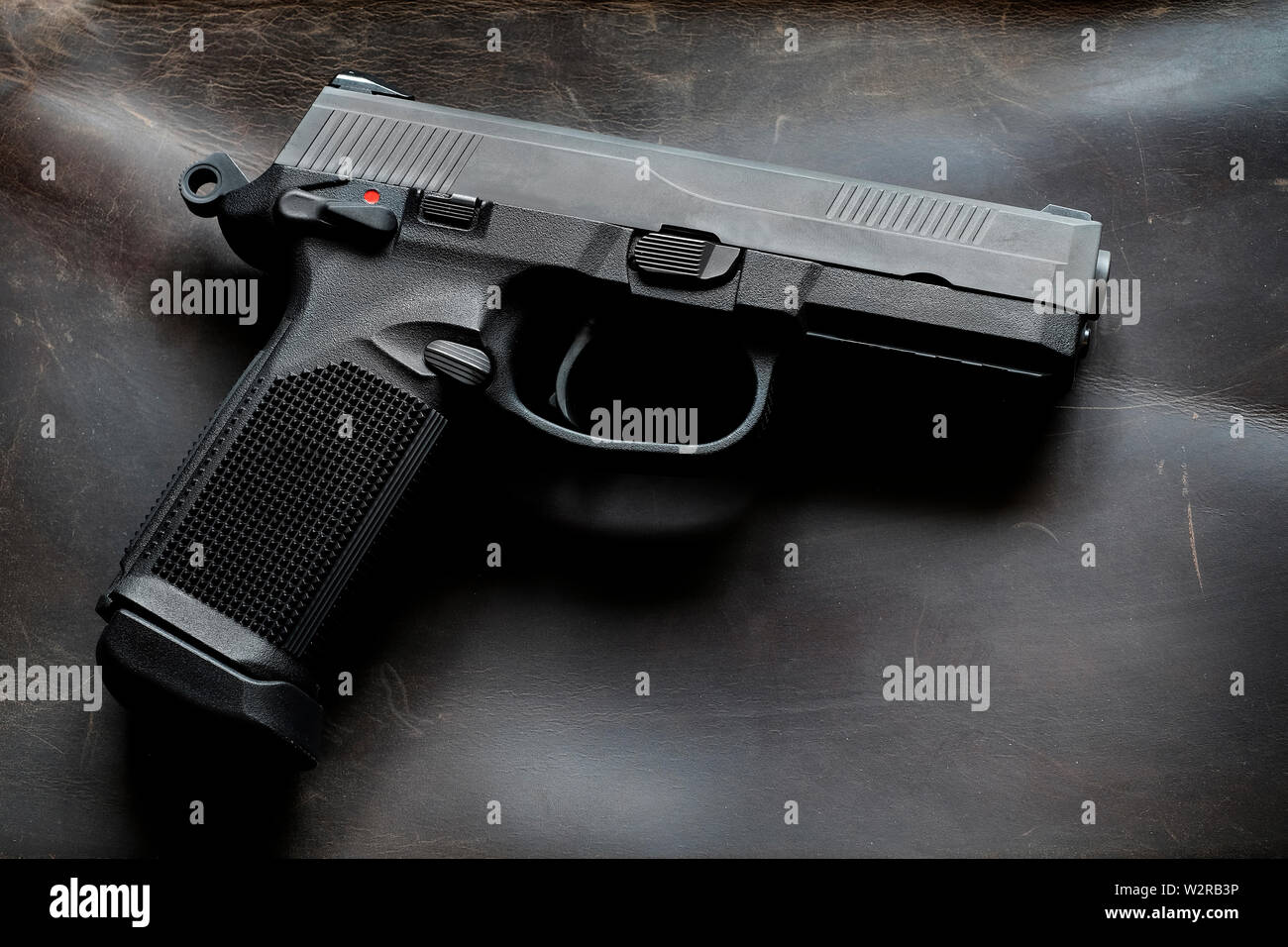 Les armes de poing pistolets ou armes de texture de fond en cuir pour l'autodéfense Banque D'Images