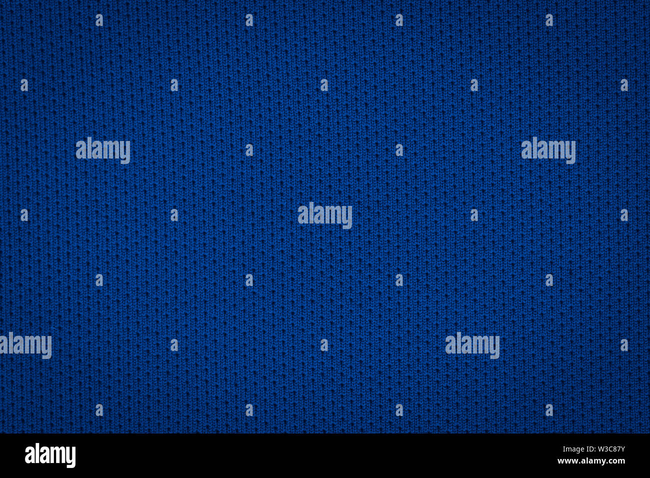 La texture d'un vrai bleu foncé tricoter. Fond en tissu. Banque D'Images