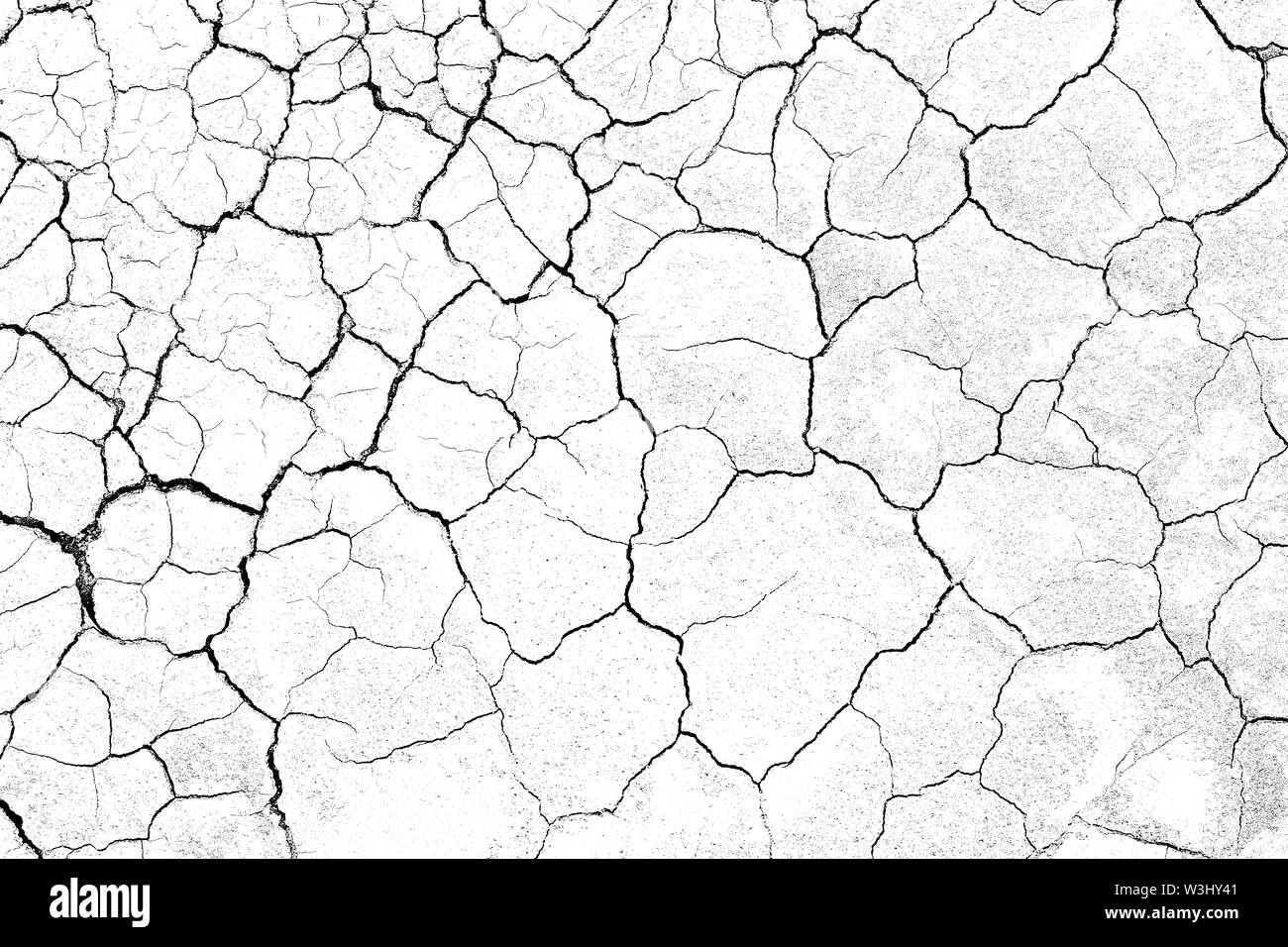 La masse du sol fissuré Structure texture terre sur fond blanc, des fissures à la surface du désert, la sécheresse dans les zones arides, terres a de nombreuses rainures et des rayures Banque D'Images