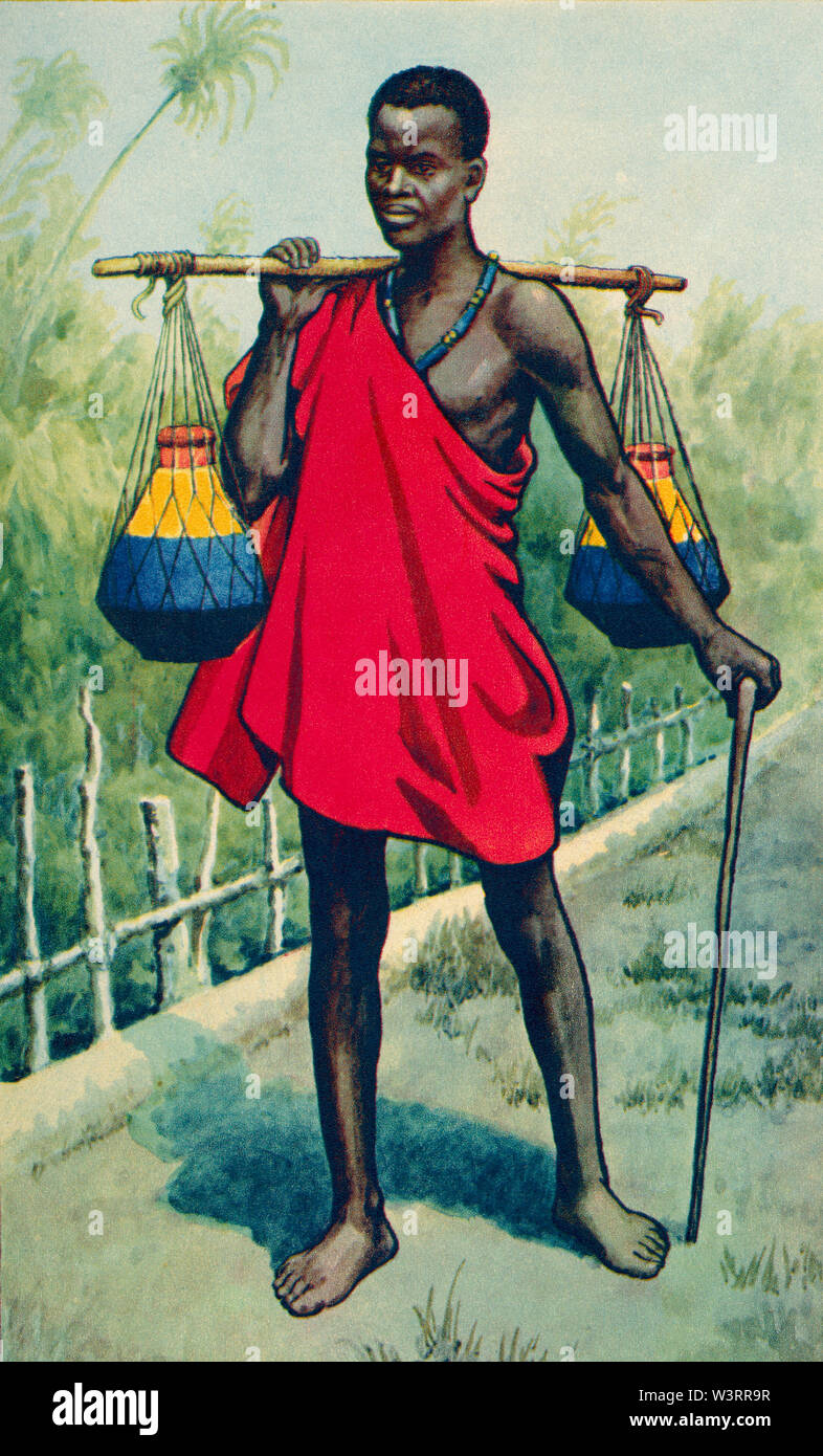 Originaire de l'Ouganda exerçant son lait. À partir d'une impression contemporaine, c.1935. Banque D'Images