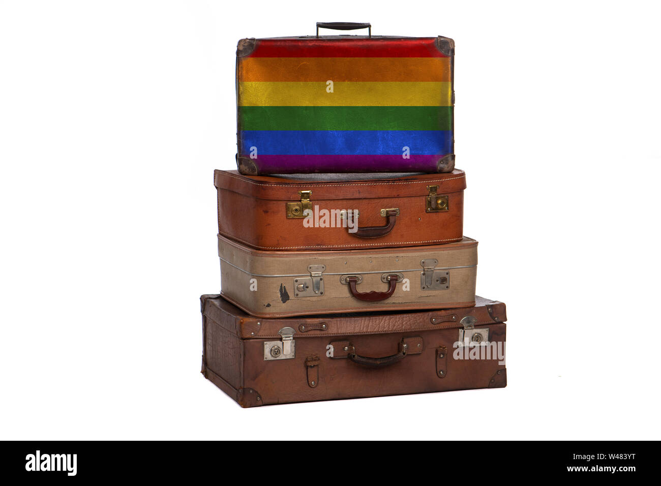 Gay Pride Travel concept. Groupe des valises vintage isolé sur fond blanc Banque D'Images