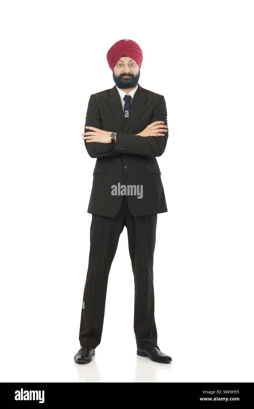Businessman standing with his arms crossed Banque D'Images