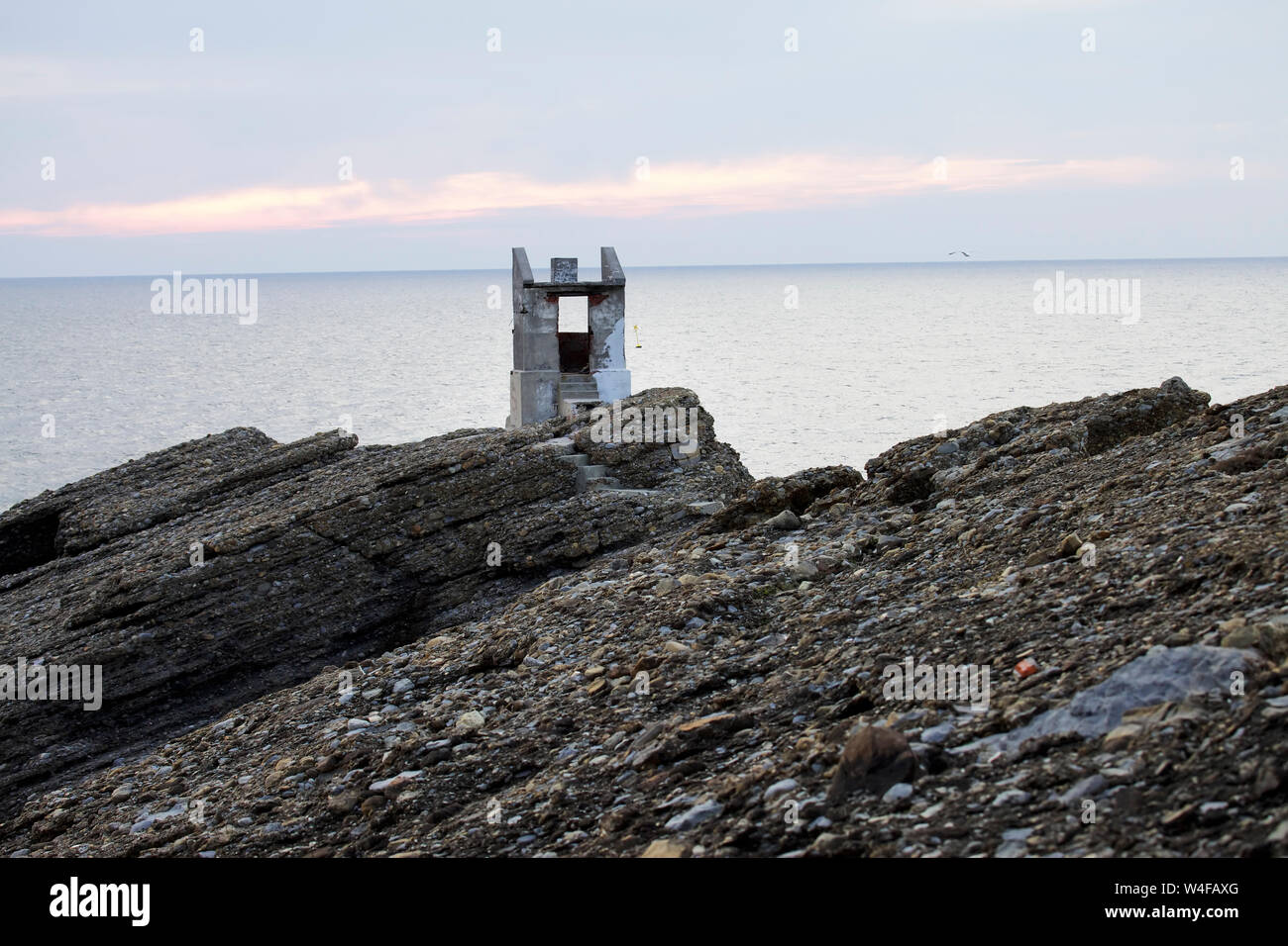 Reef nommé Pays Maroc avec des nuages au coucher du soleil. La Ligurie. Italie Banque D'Images