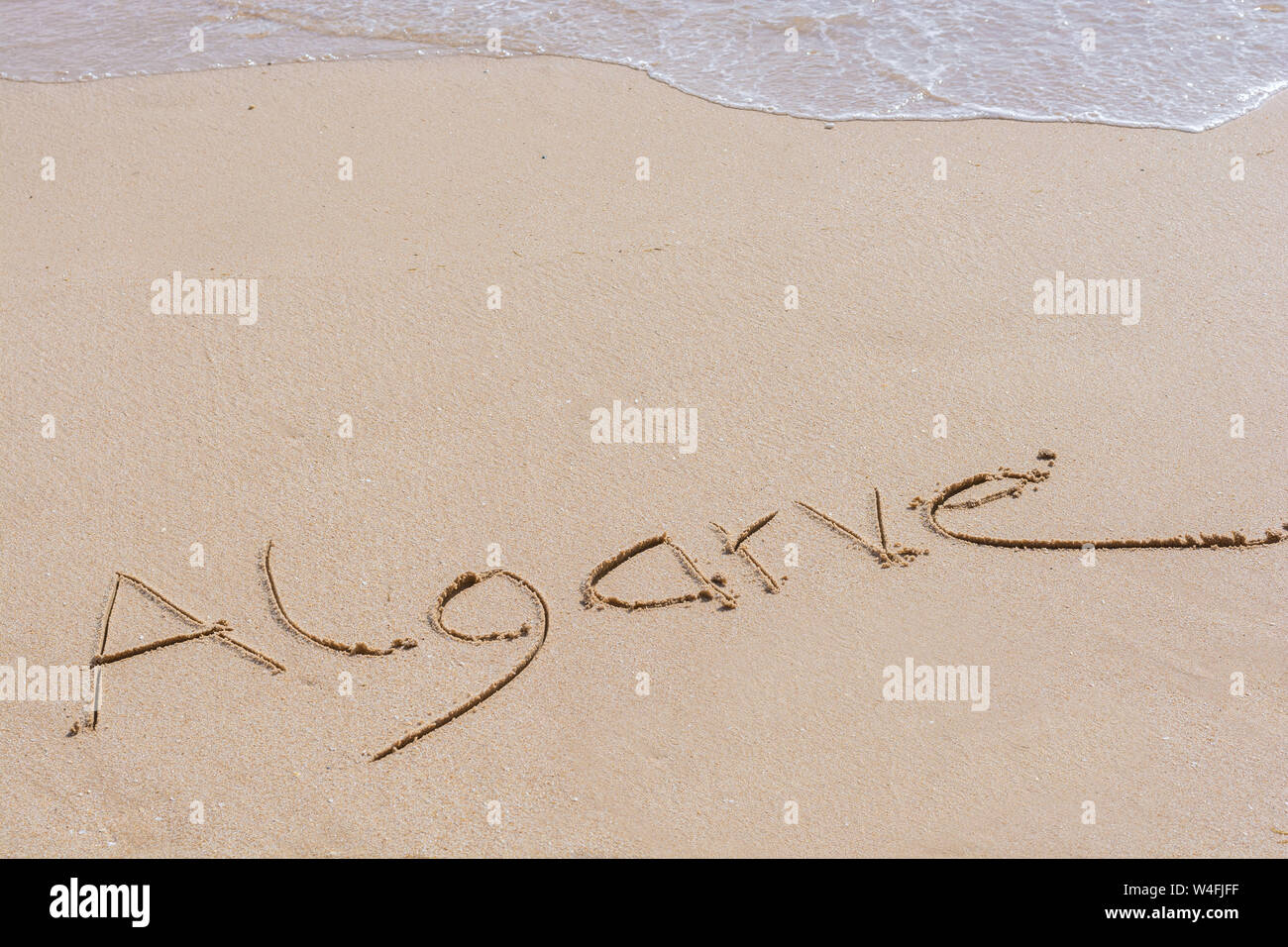 Le mot écrit dans l'Algarve portugais beach Banque D'Images