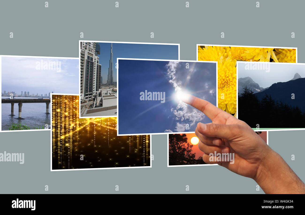Doigt humain sélectionnant une image sur l'écran virtuel Banque D'Images