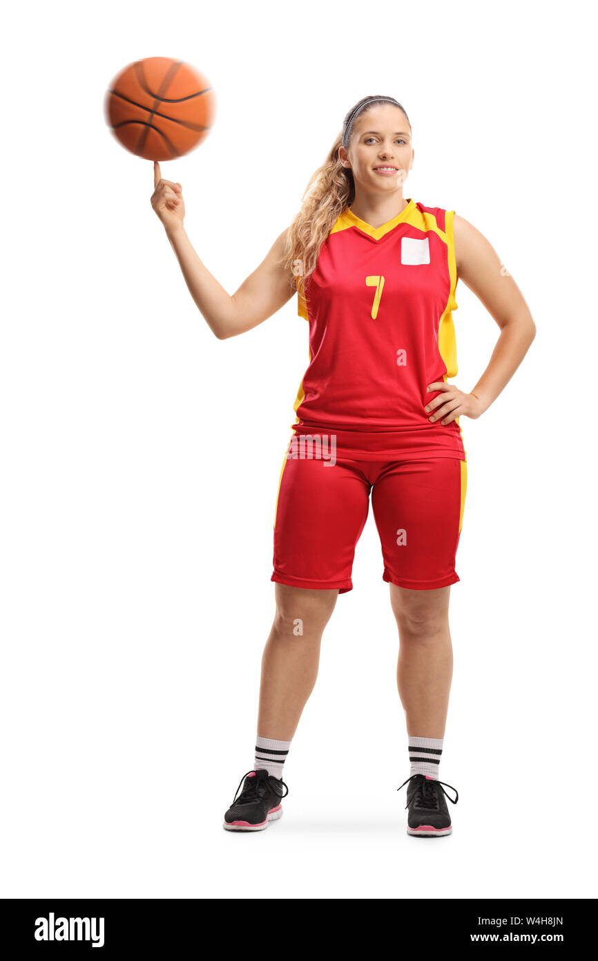 Portrait d'un jeune joueur de basket-ball féminin de tourner une boule avec  un doigt isolé sur fond blanc Photo Stock - Alamy