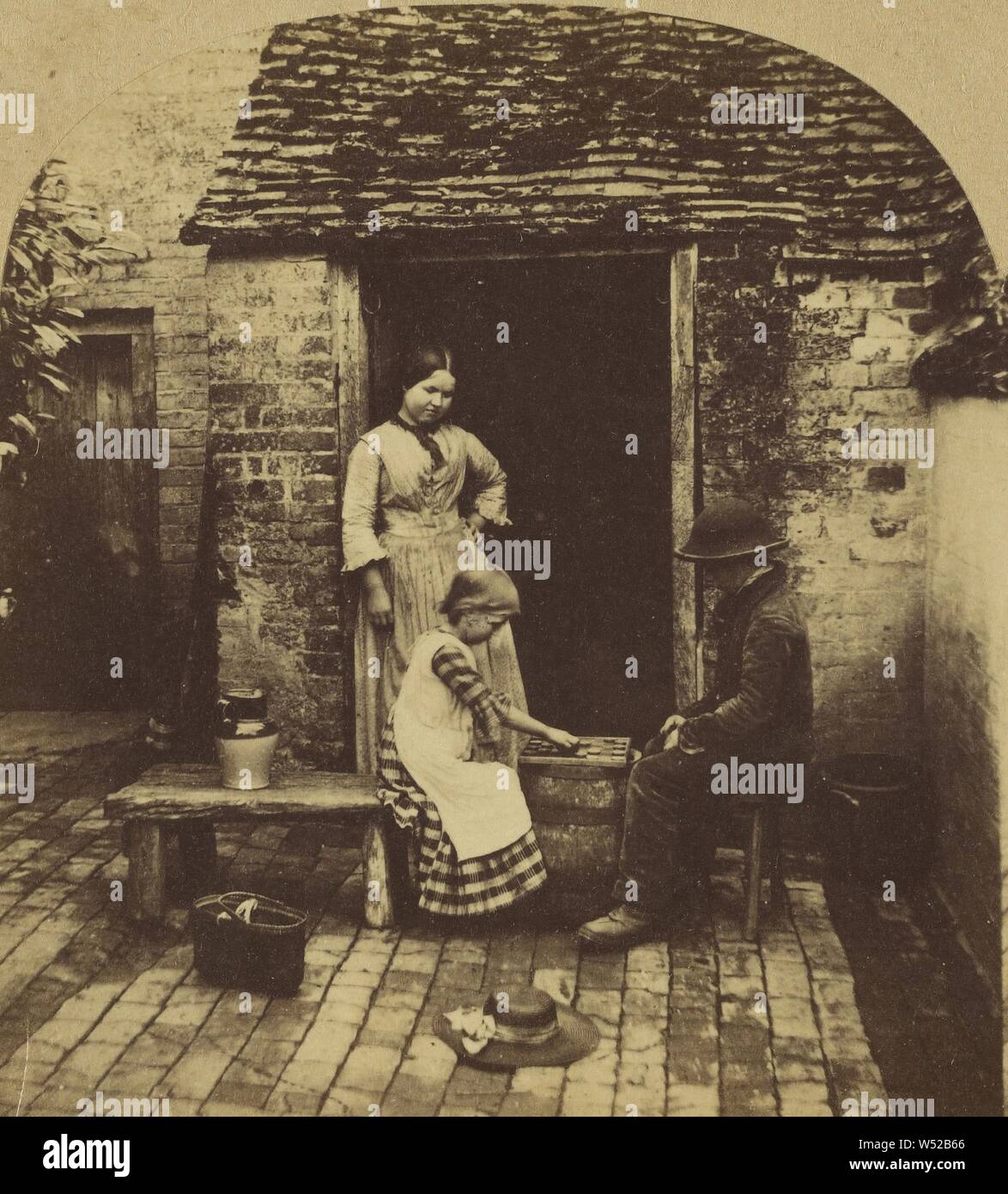 Un jeu de dames., London Stereoscopic Company (Actif 1854 - 1890), vers 1860, à l'albumine argentique Banque D'Images