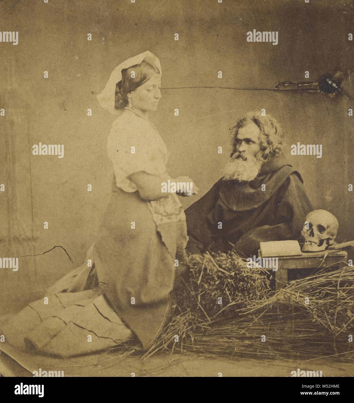 Genre : Femme sur les genoux en face de l'homme barbu blanc, crâne et livre ouvert sur une petite table, inconnu, vers 1860, à l'albumine argentique Banque D'Images