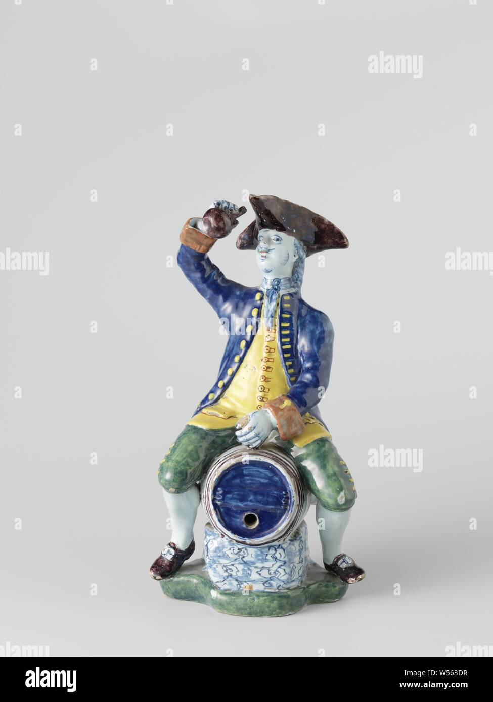 Couvercle avec l'homme et point triangulaire bouteille dans la main, sur le corps, le couvercle de l'objet décoratif de faïences multicolores., anonyme, Delft, c. 1760 - c. 1790, faïence, émail étain, H 2,0 cm × 2,7 cm d Banque D'Images