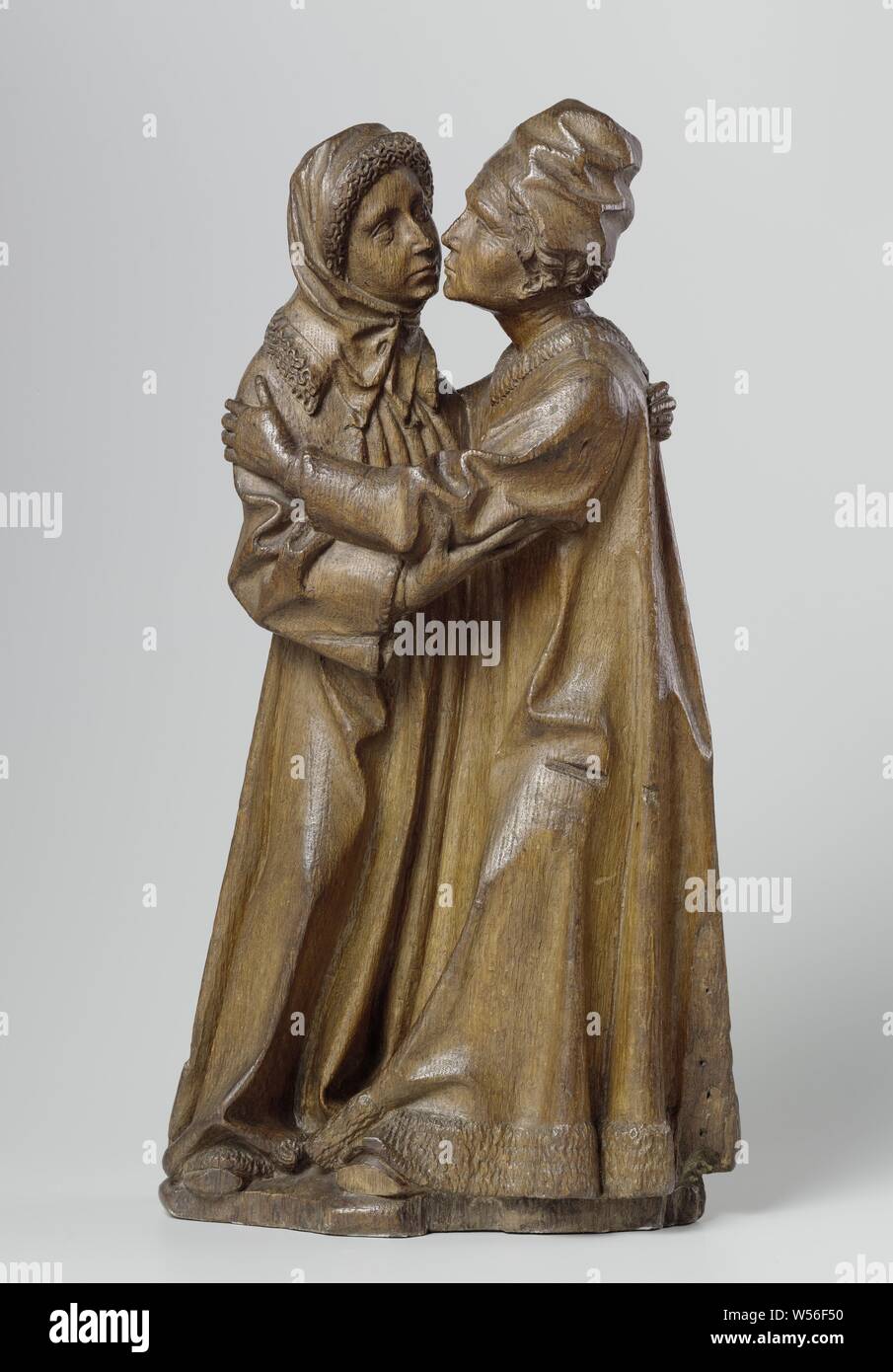 La rencontre de Joachim et Anna la rencontre de Joachim et Anna la rencontre de Joachim et Anna la rencontre de Joachim et Anne, sur un morceau de terre, Joachim et Anna sont légèrement en face de l'autre comme un groupe fermé, Joachim avec la jambe gauche en avant, le haut du corps se tourna vers elle, Anna en appui sur la jambe gauche et le côté droit de côté. Il a les deux bras autour des épaules d'Anna pour une accolade, elle tend à lui faire face pour recevoir le baiser, alors qu'elle appuie son coude gauche avec la main droite et a mis l'autre sur son dos de manière confidentielle. Les rides sur le front de Joachim, à ses yeux et de la bouche, comme Banque D'Images