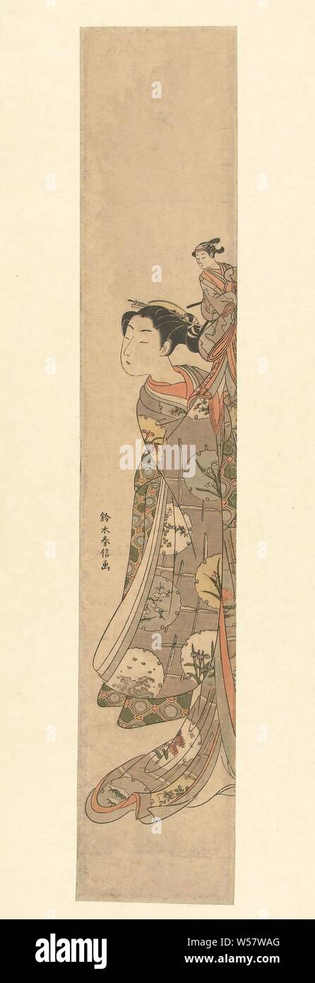 Girl holding up une marionnette à main d'un acteur dans un rôle de femme, Suzuki Harunobu (mentionné sur l'objet), Japon, 1765 - 1770, gravure sur bois, papier couleur, h 702 mm × W 126 mm Banque D'Images